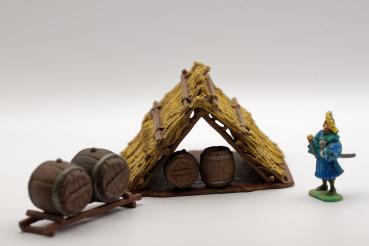 Straw hut with barrels painted